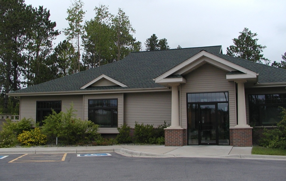Dr. Hagley and staff outside the office of Grand Rapids Dental Care