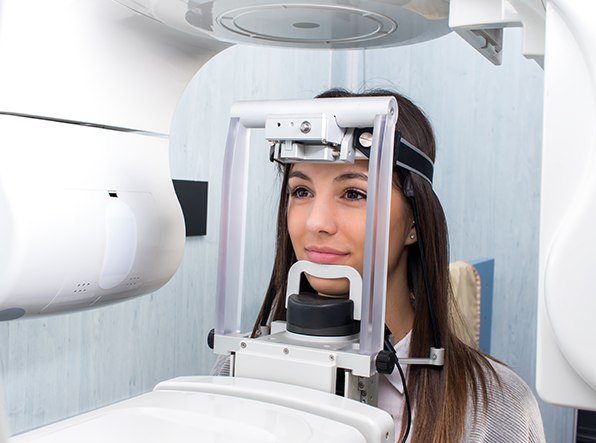 Young woman in x-ray machine 