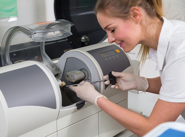 woman working with cerec machine