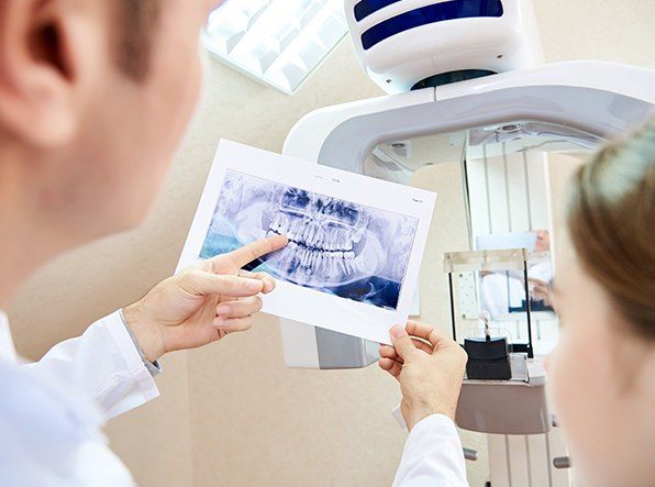 dentist pointing to x-ray