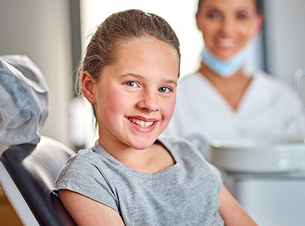 girl at dentist smiling