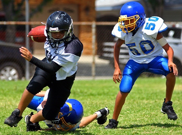 boys playing football