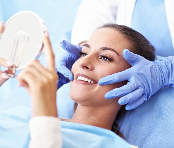 woman smiling in circle mirror