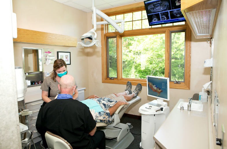 Grand Rapids team member working with patient