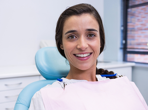 brunette woman smiling at camera