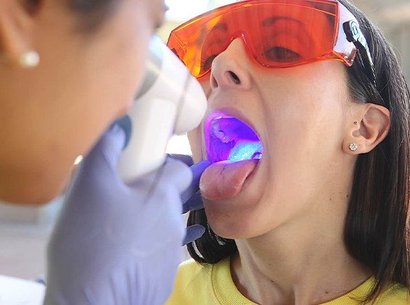 woman getting oral cancer screening