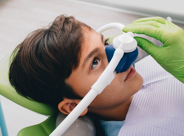 boy with nitrous oxide mask on